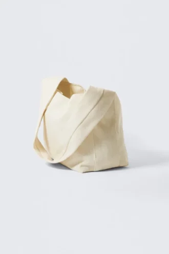 Blød skuldertaske i canvas – lys beige