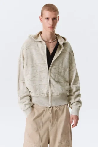 Boxy tekstureret strikket hættetrøje med lynlås – lys mønstret beige