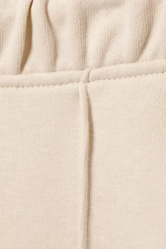 Joggingbukser med mellemhøj talje, pintuck og udvidede ben – lys beige